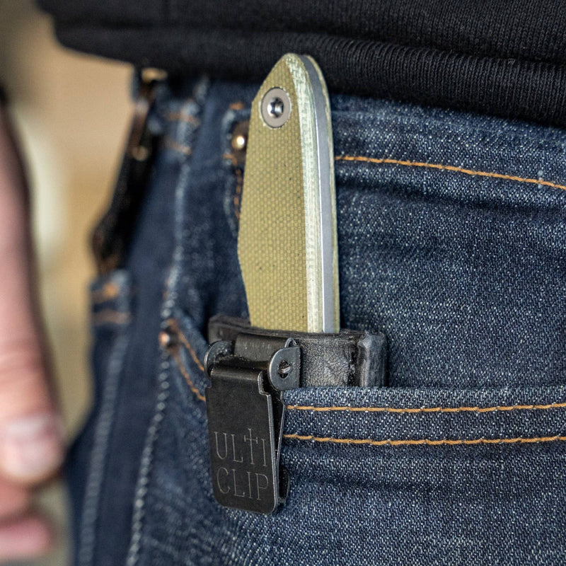 BIGiDESIGN-USA USA Lookout Fixed Blade knife clipped in blue jean pocket with black Ultra Clip sheath